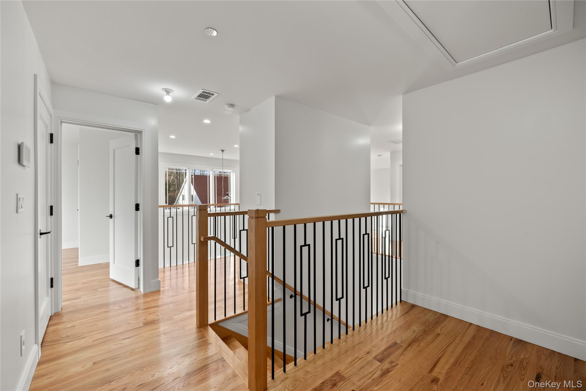63 Dessau Circle, Unit 52 Spring Valley, NY 10977 - Photo 33 of 48 a view of a hallway with wooden floor