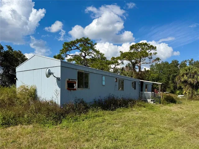 a backyard of a house with lots of green space