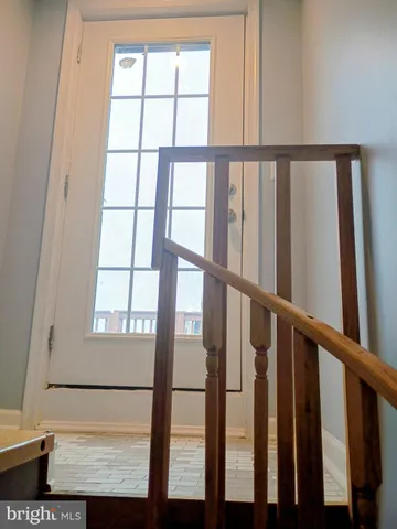 a view of staircase with a window