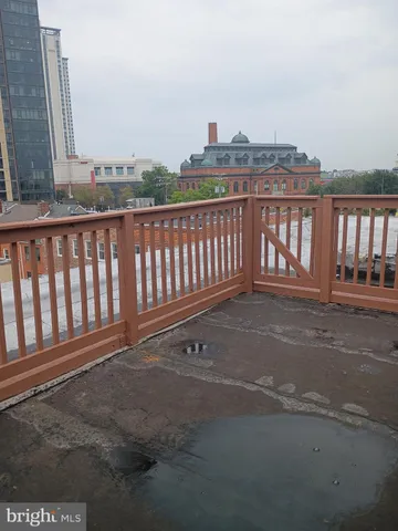 a view of a balcony with wooden floor