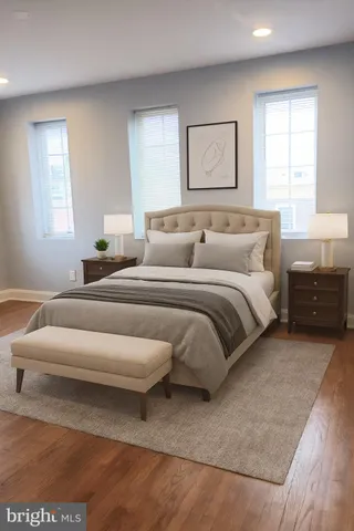 a bedroom with a bed and a couch