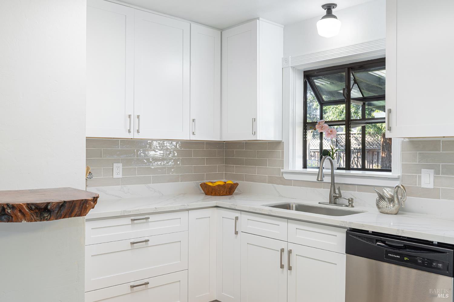 1225 Matanzas Way Santa Rosa, CA 95405 - Photo 14 of 44 a kitchen with a sink and cabinets