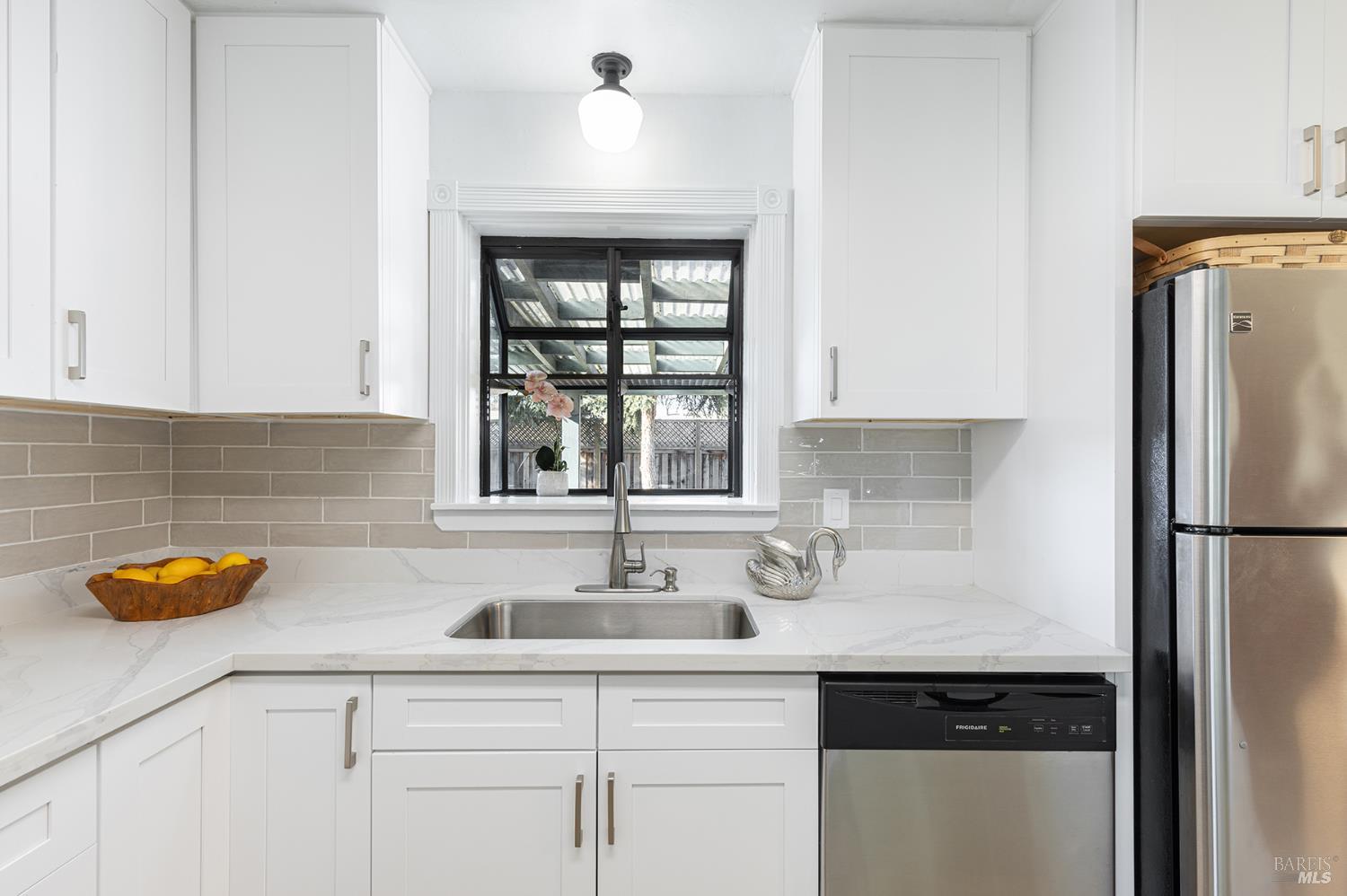 1225 Matanzas Way Santa Rosa, CA 95405 - Photo 19 of 44 a kitchen with stainless steel appliances granite countertop a sink and a refrigerator