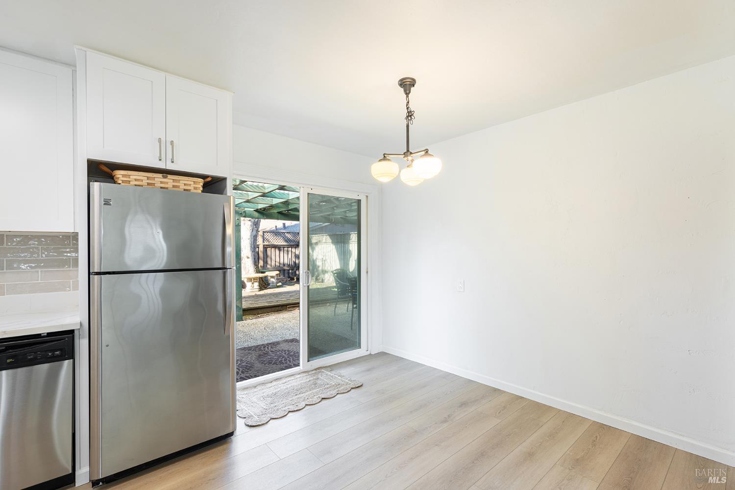 1225 Matanzas Way Santa Rosa, CA 95405 - Photo 20 of 44 a metallic refrigerator freezer sitting in a kitchen