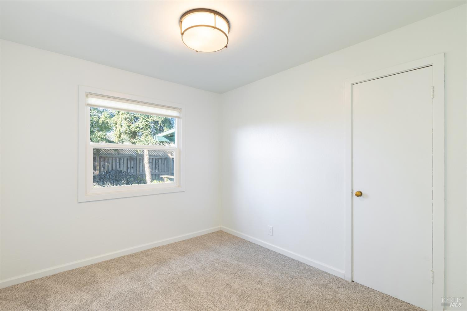 1225 Matanzas Way Santa Rosa, CA 95405 - Photo 27 of 44 an empty room with windows