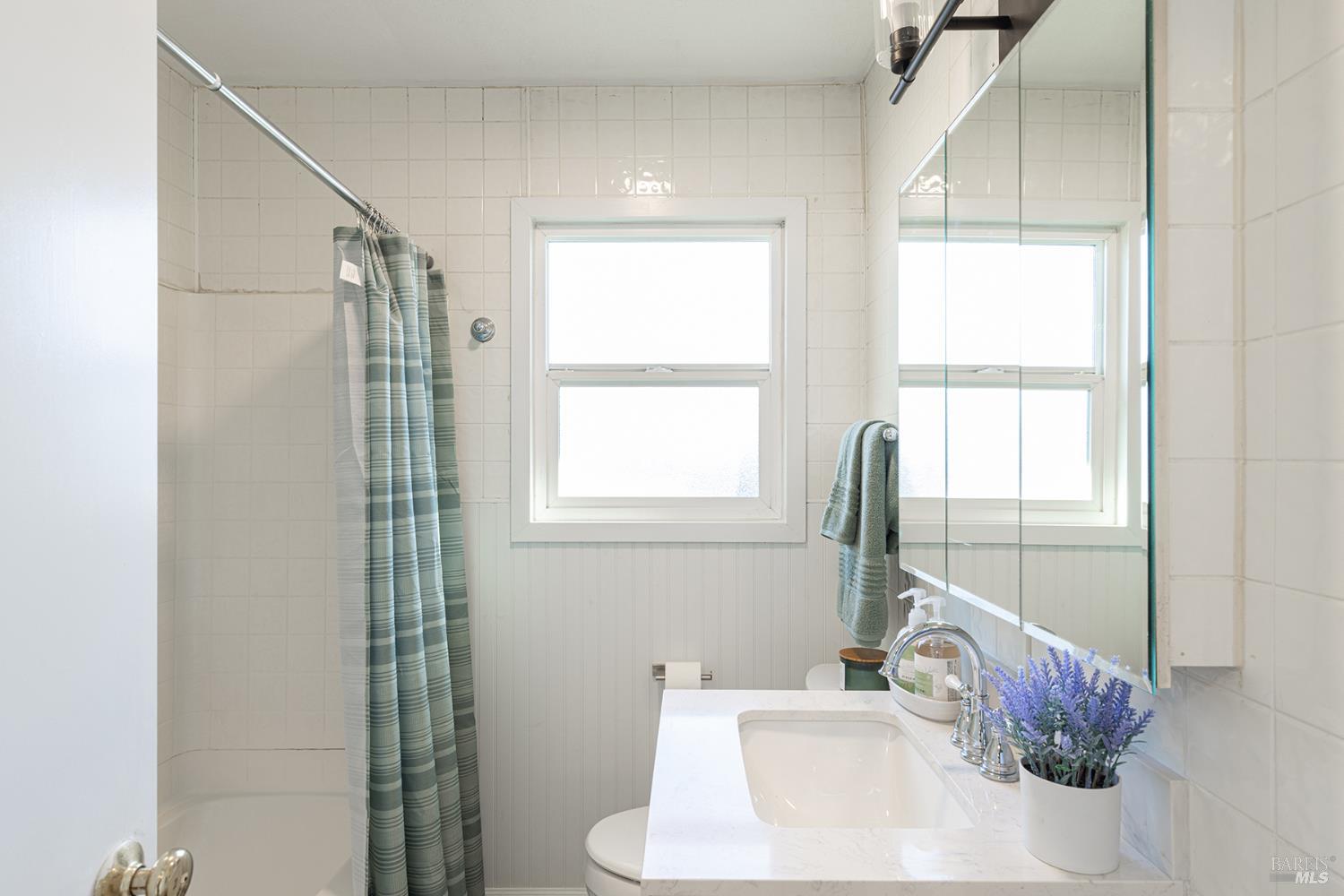 1225 Matanzas Way Santa Rosa, CA 95405 - Photo 31 of 44 a bathroom with a sink and a window