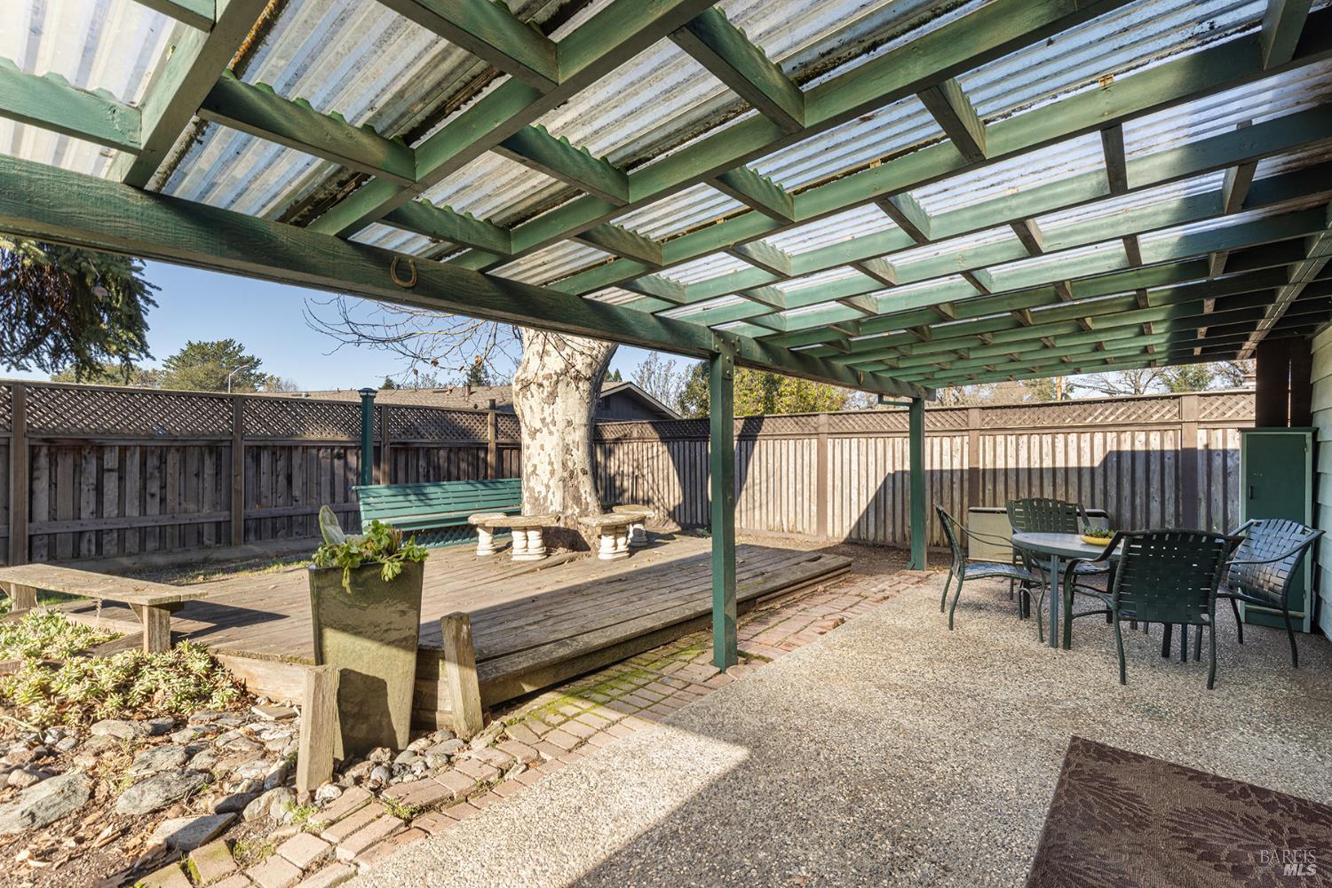 1225 Matanzas Way Santa Rosa, CA 95405 - Photo 33 of 44 a view of a patio with table and chairs with wooden floor