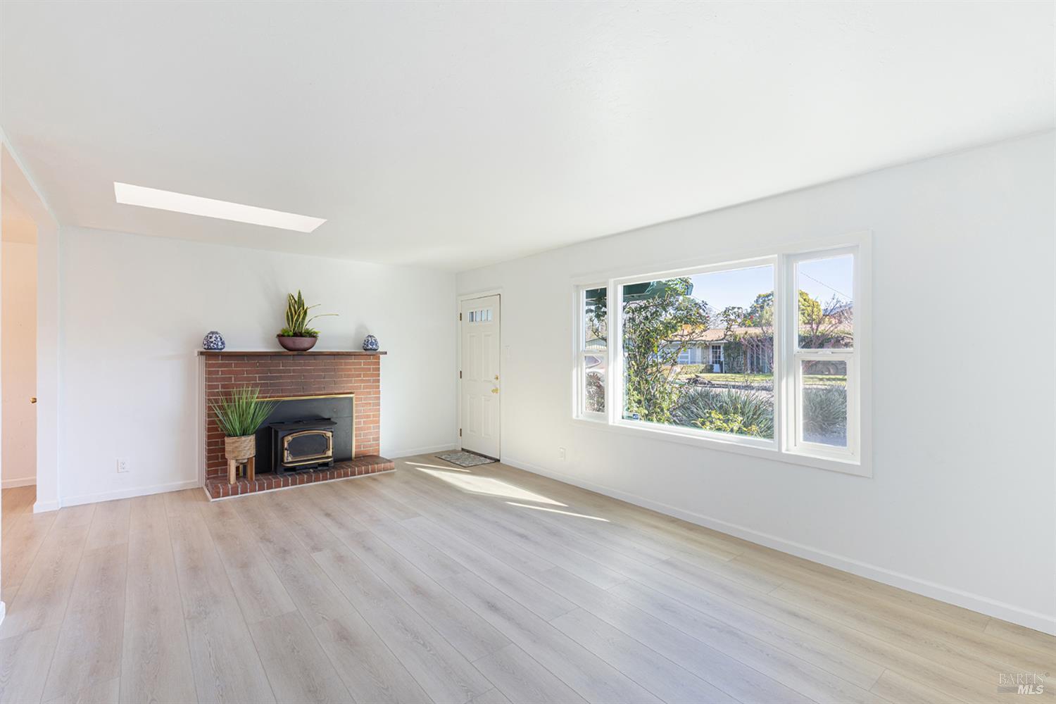 1225 Matanzas Way Santa Rosa, CA 95405 - Photo 8 of 44 a view of an empty room with window and a fireplace