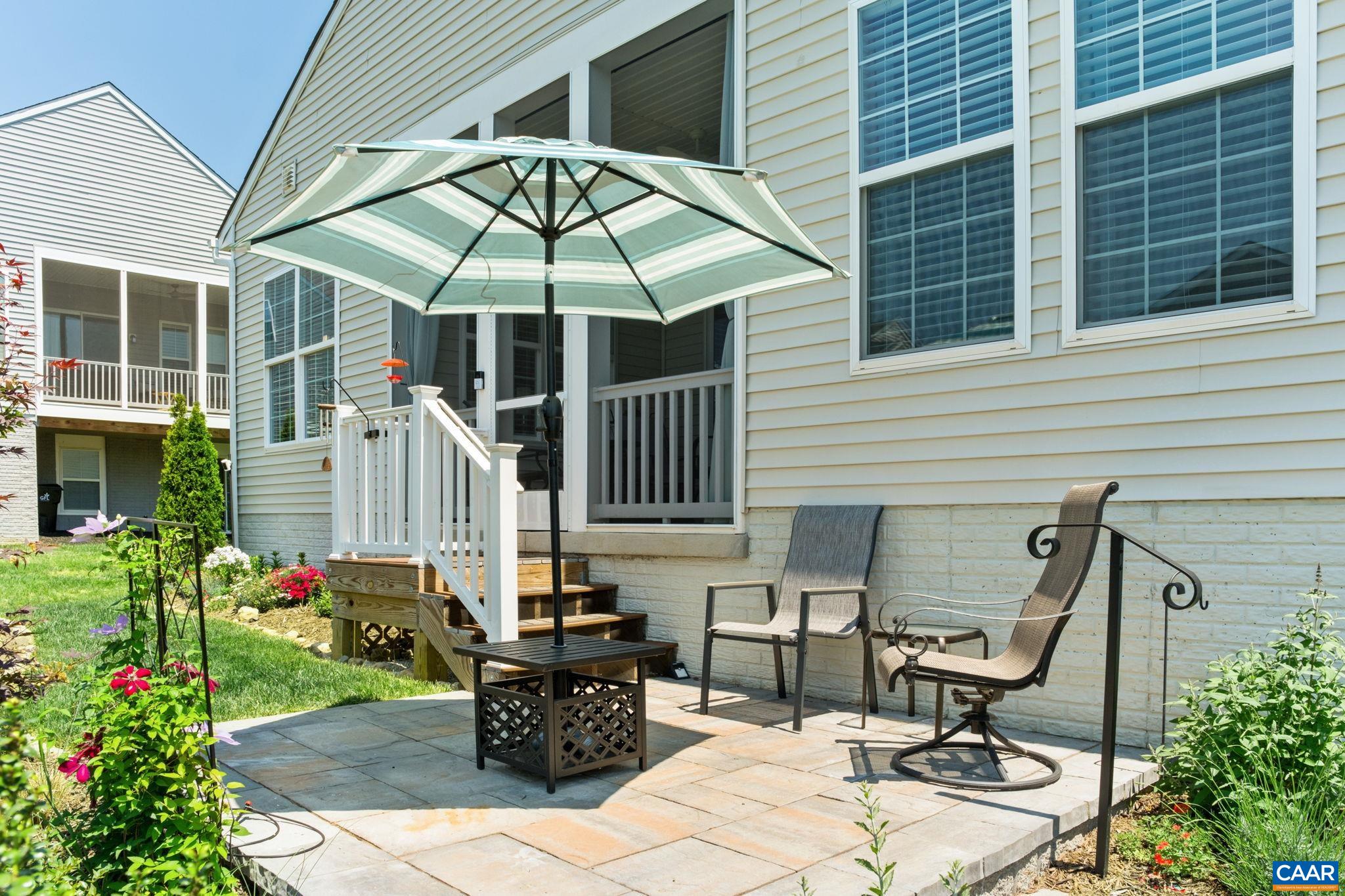 124 Stodghill Drive Ruckersville, VA 22968 - Photo 37 of 58 a backyard of a house with table and chairs
