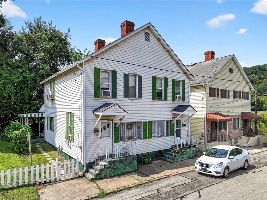 a front view of a house with a porch
