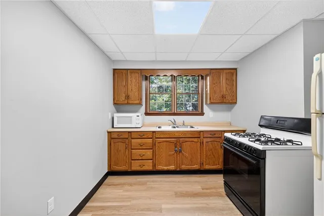a kitchen that has a sink and a stove