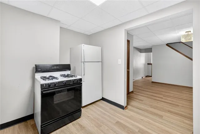 a kitchen with a stove and a refrigerator