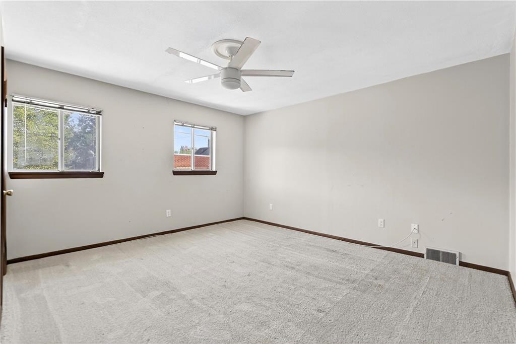 108 9th Street Monongahela, PA 15063 - Photo 19 of 31 an empty room with windows and fan
