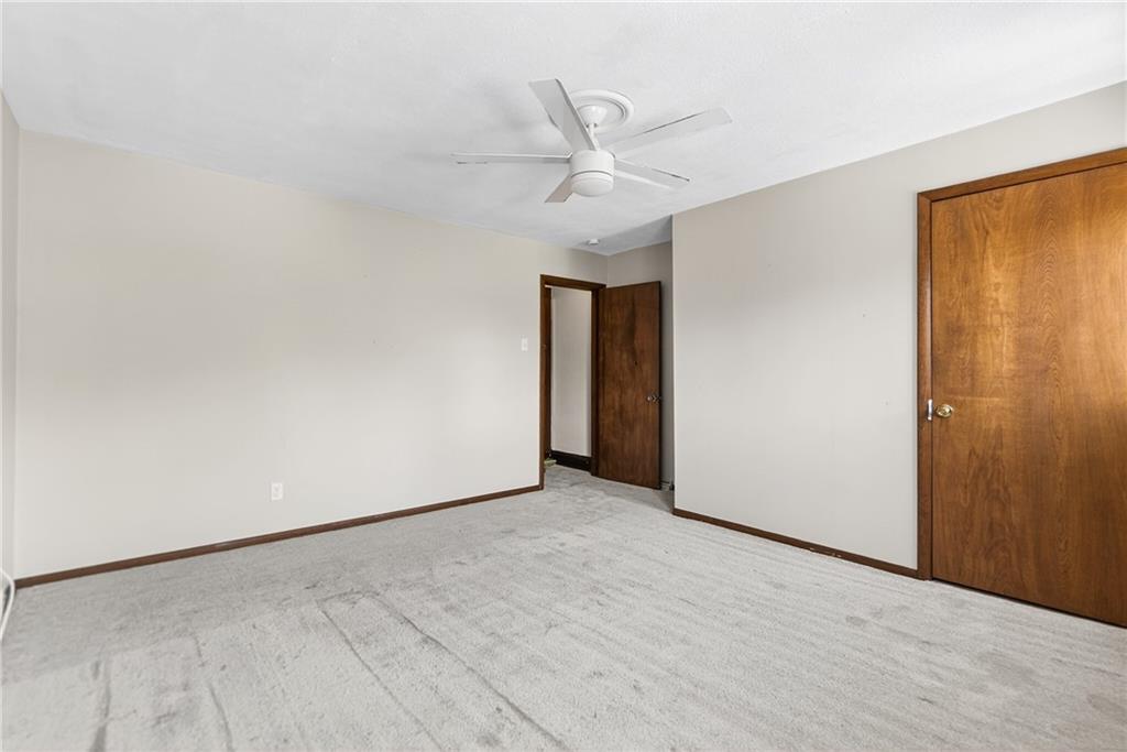 108 9th Street Monongahela, PA 15063 - Photo 20 of 31 an empty room with a ceiling fan and a window