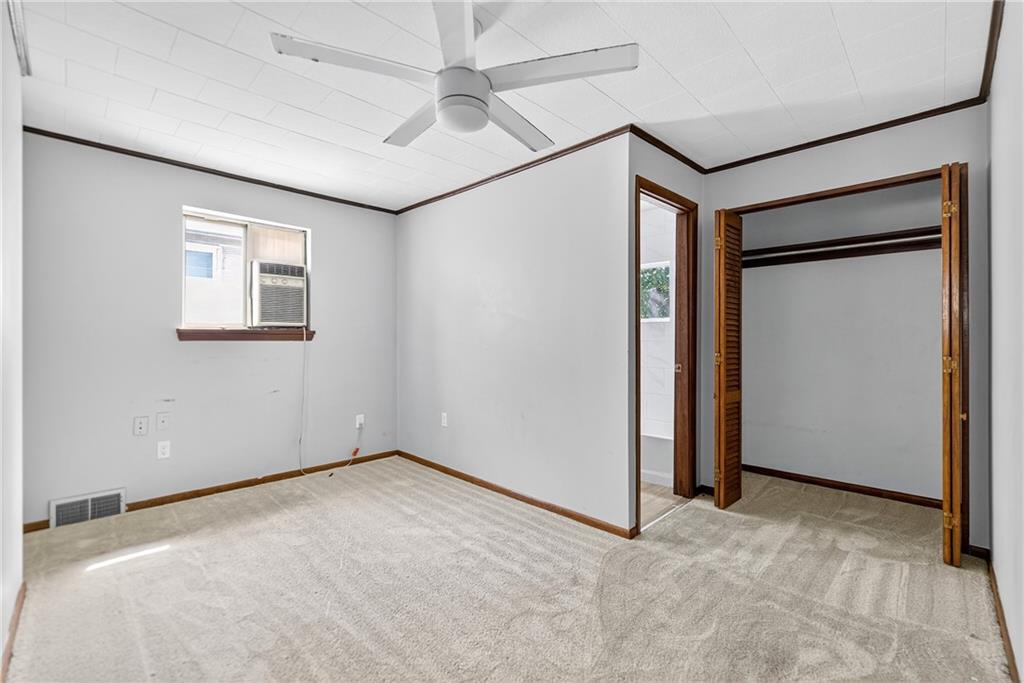 108 9th Street Monongahela, PA 15063 - Photo 21 of 31 an empty room with windows and fan