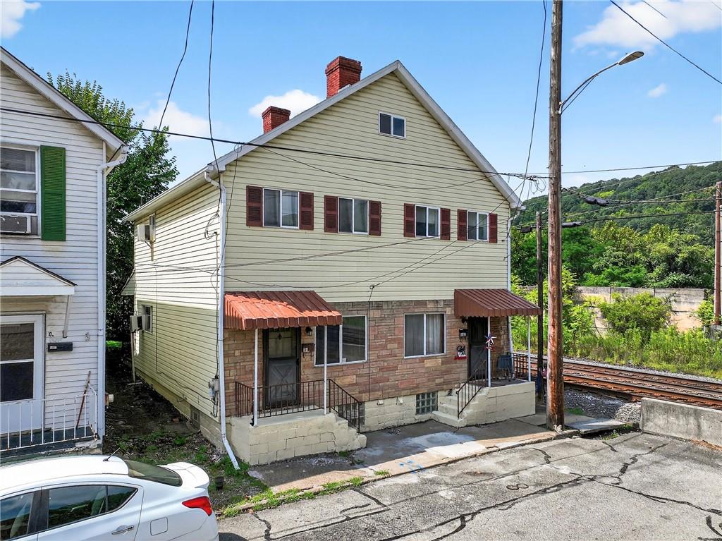 108 9th Street Monongahela, PA 15063 - Photo 5 of 31 a front view of a house with a yard