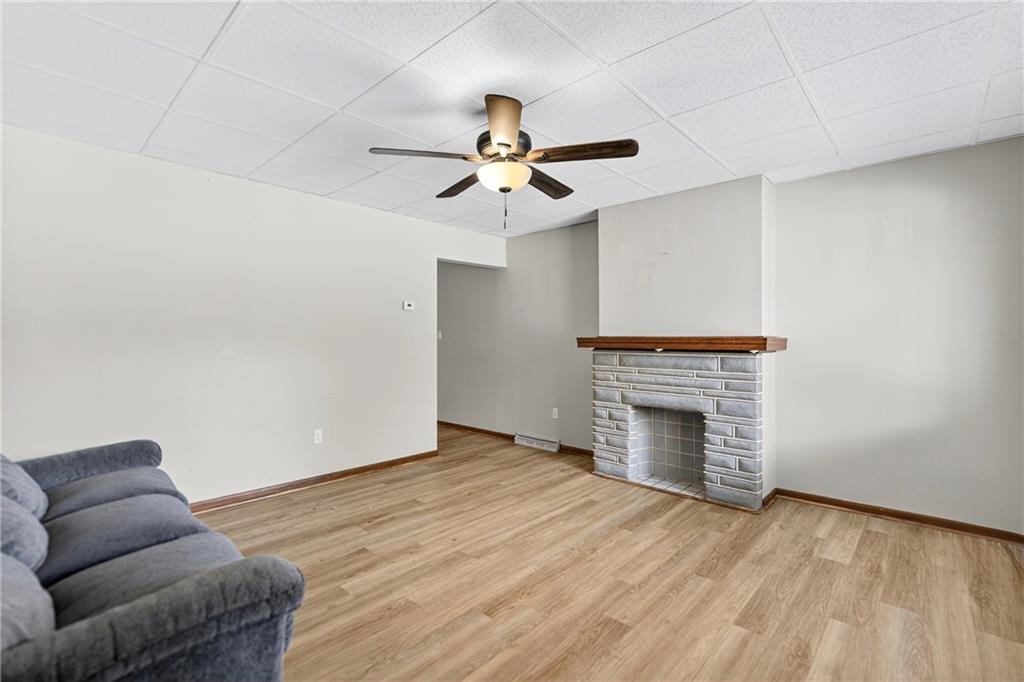 108 9th Street Monongahela, PA 15063 - Photo 9 of 31 an empty room with furniture and a fireplace