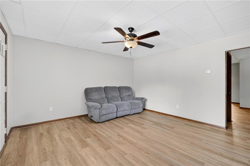 108 9th Street Monongahela, PA 15063 - Photo 10 of 31 a view of room with hardwood floor and a ceiling fan