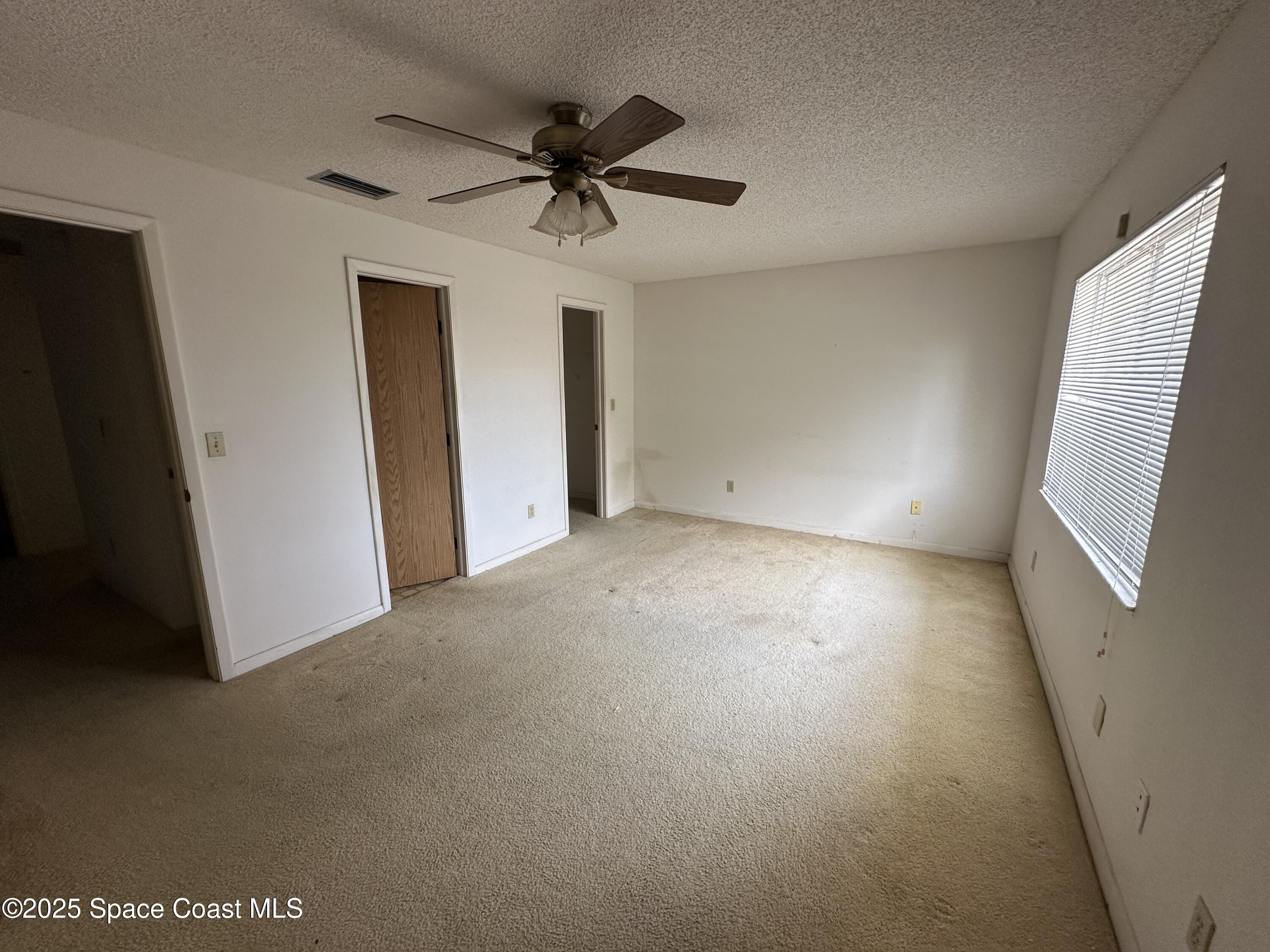 1882 Murrell Road, Unit J36 Rockledge, FL 32955 - Photo 12 of 12 a view of a livingroom with a ceiling fan