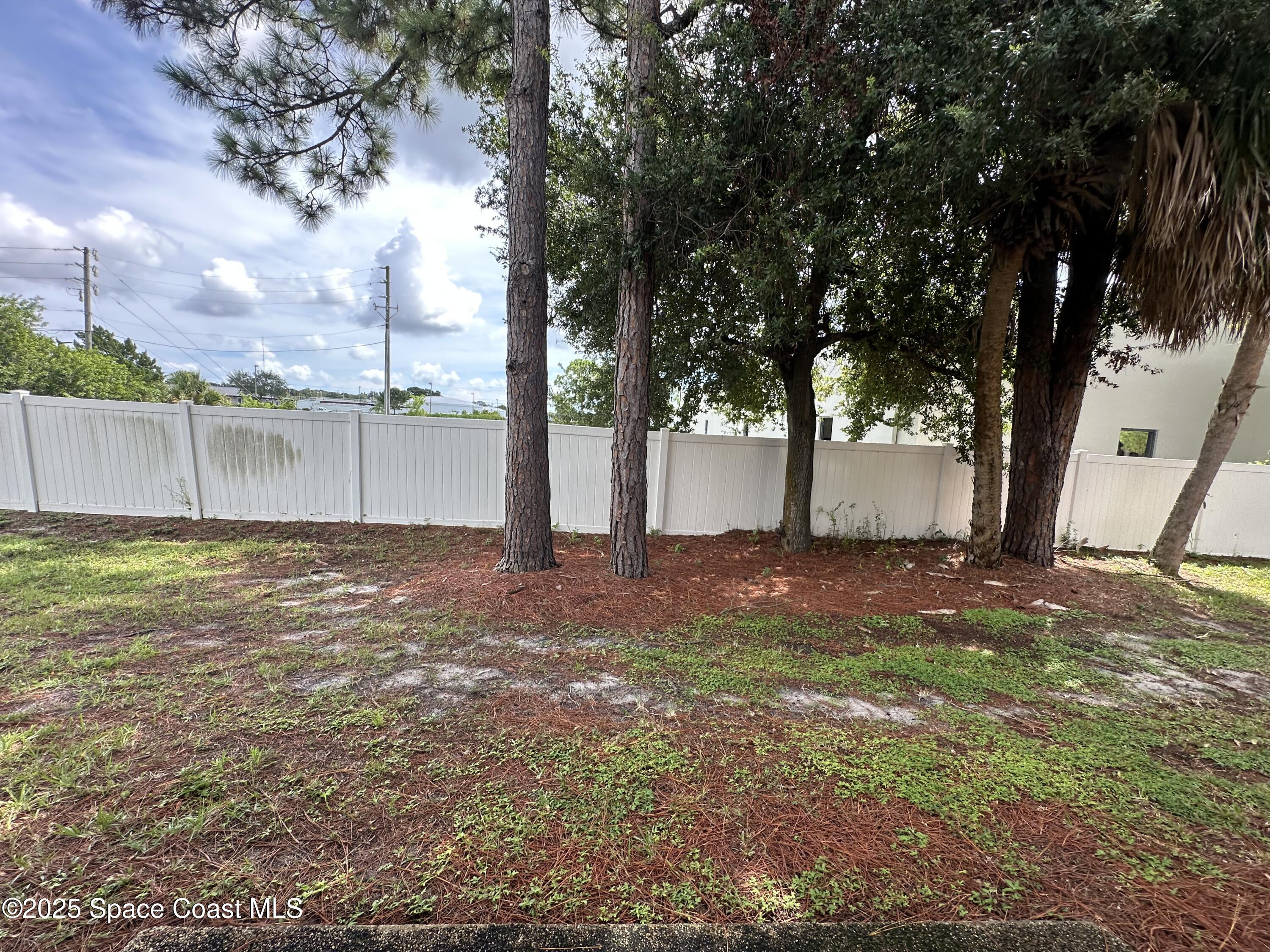 1882 Murrell Road, Unit J36 Rockledge, FL 32955 - Photo 4 of 12 a view of outdoor space with deck and yard
