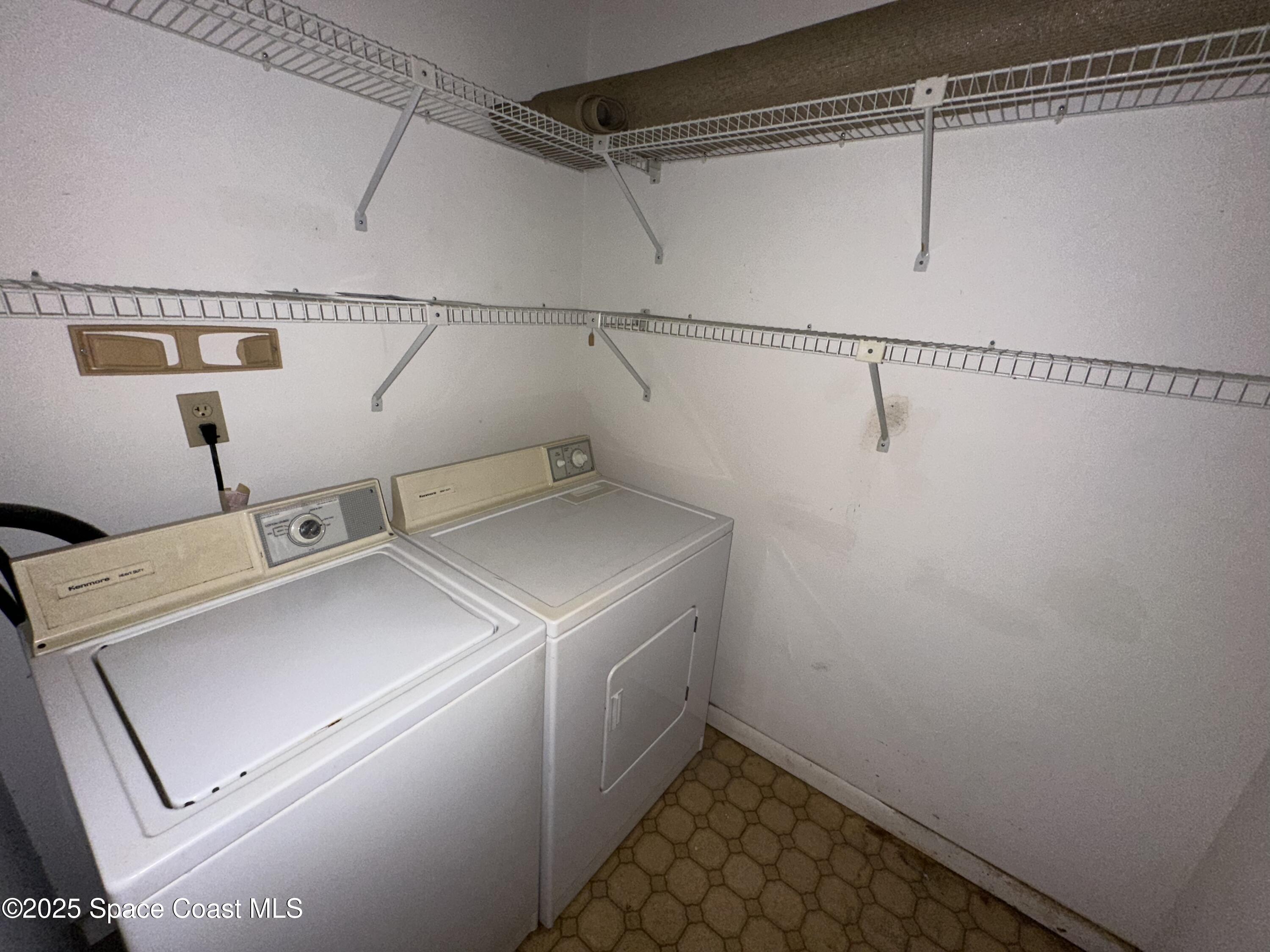1882 Murrell Road, Unit J36 Rockledge, FL 32955 - Photo 9 of 12 a utility room with dryer and washer