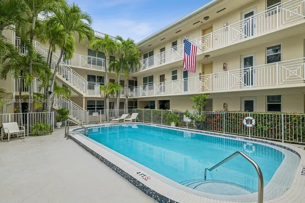 a view of a building with a swimming pool