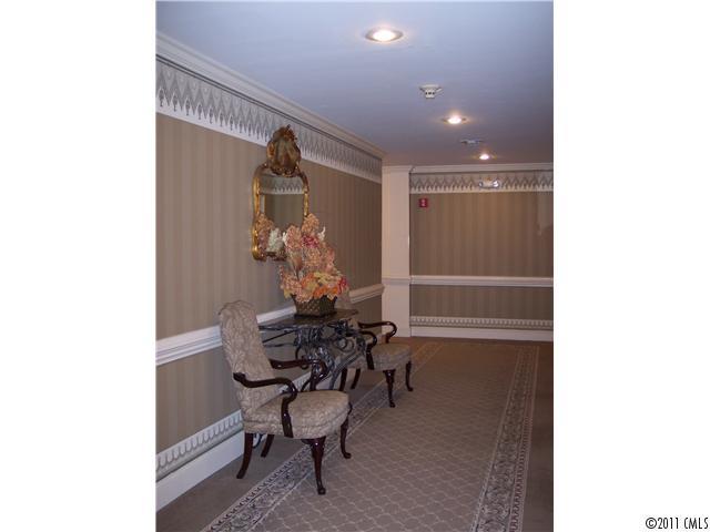 1301 Queens Road, Unit 502 Charlotte, NC 28207 - Photo 3 of 4 a dining room with furniture and wooden floor