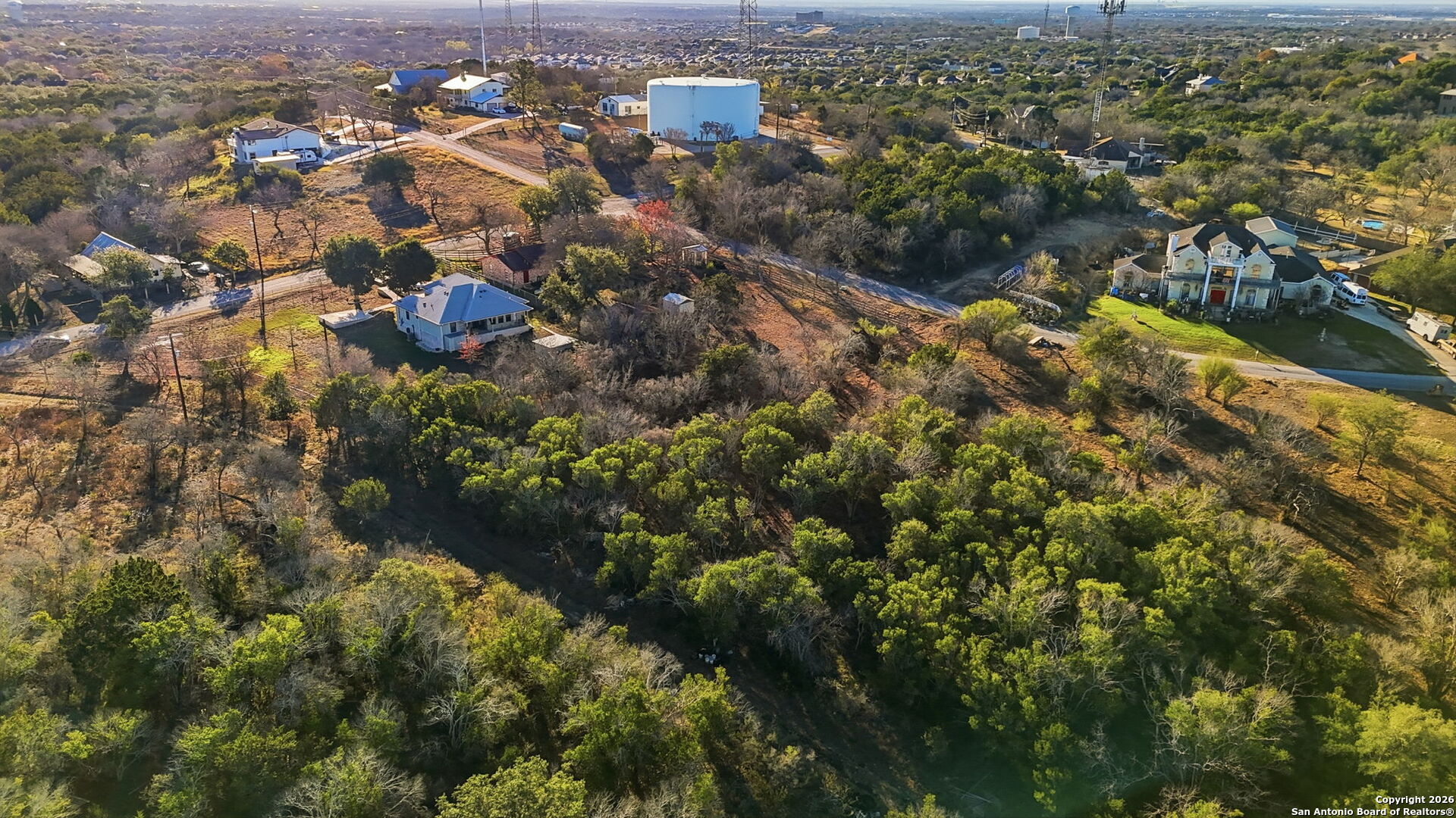 0 Wesp Way, Unit 3 Live Oak, TX 78233 - Photo 8 of 8 an aerial view of residential houses with outdoor space and trees