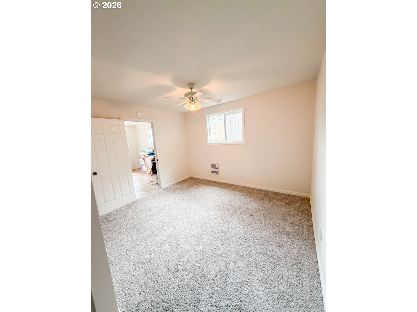 610 Tiara Street Lakeside, OR 97449 - Photo 17 of 28 a view of a big room with windows and chandelier fan