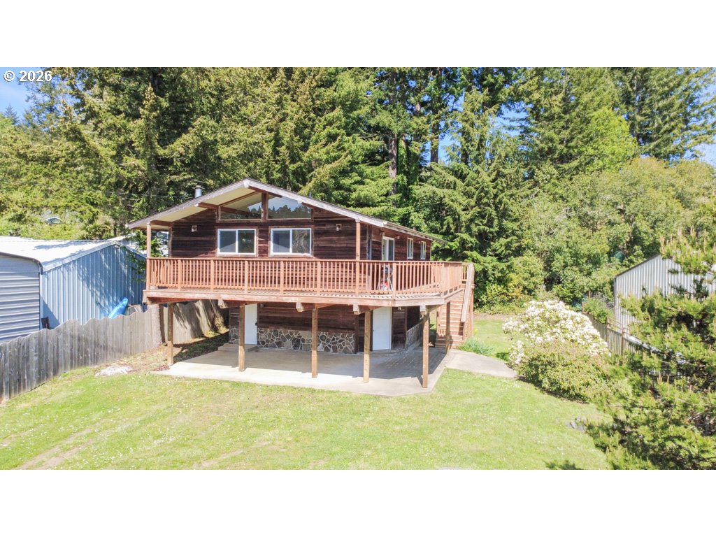 610 Tiara Street Lakeside, OR 97449 - Photo 2 of 28 a black and white photo of a house