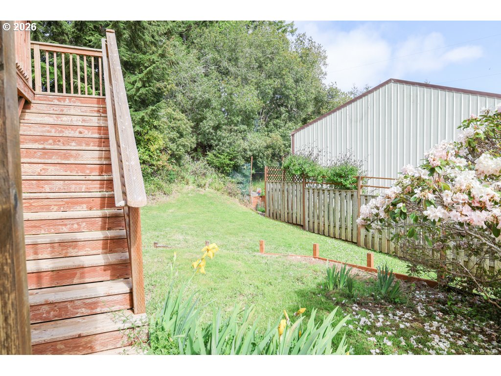 610 Tiara Street Lakeside, OR 97449 - Photo 22 of 28 a view of a backyard with pathway
