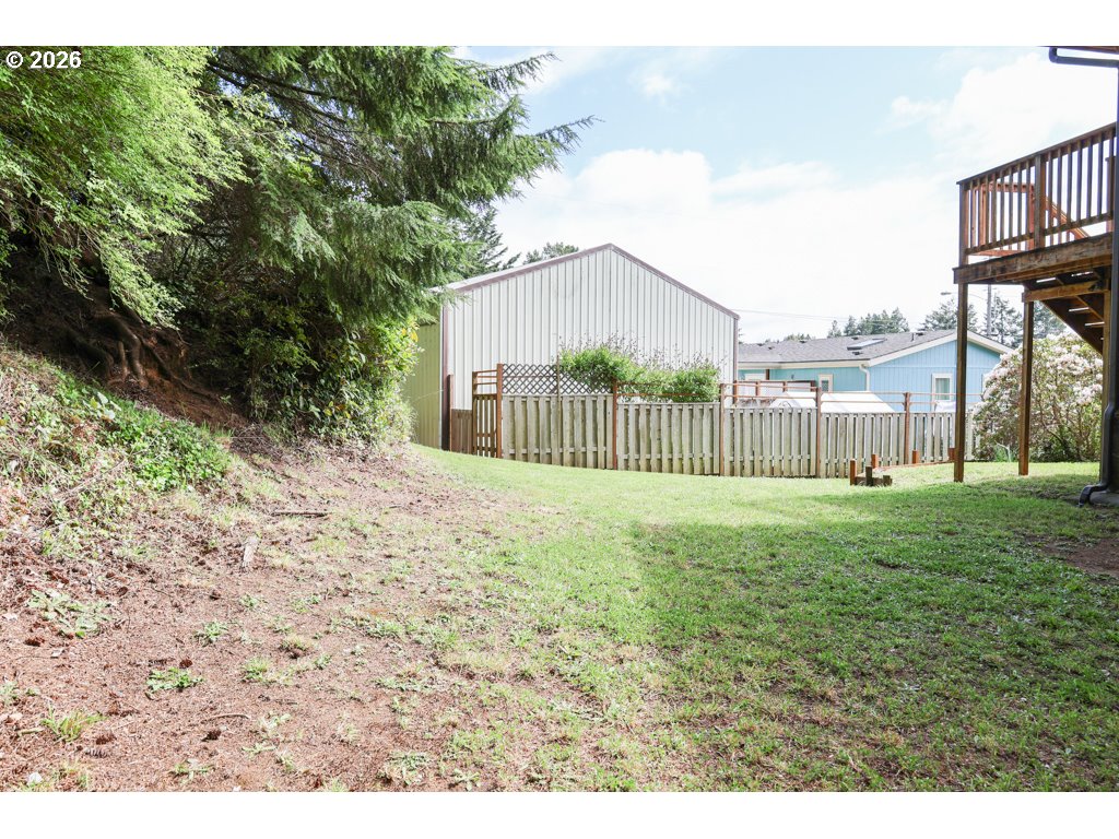 610 Tiara Street Lakeside, OR 97449 - Photo 25 of 28 a view of a yard front of house