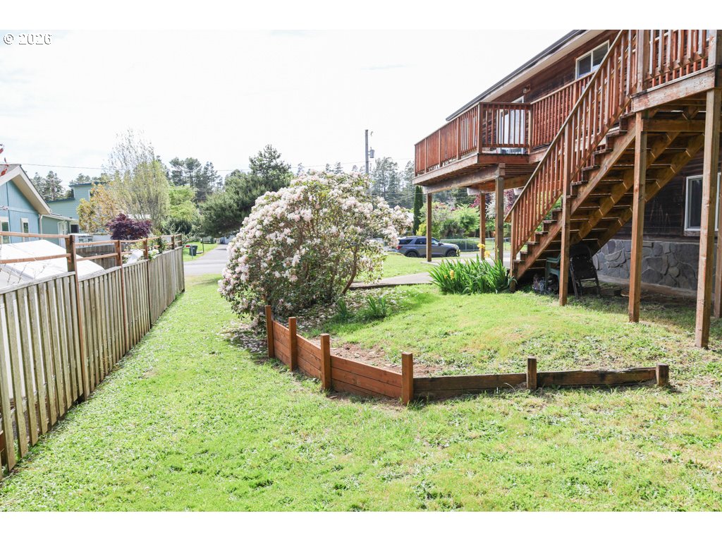 610 Tiara Street Lakeside, OR 97449 - Photo 27 of 28 a view of a house with a yard