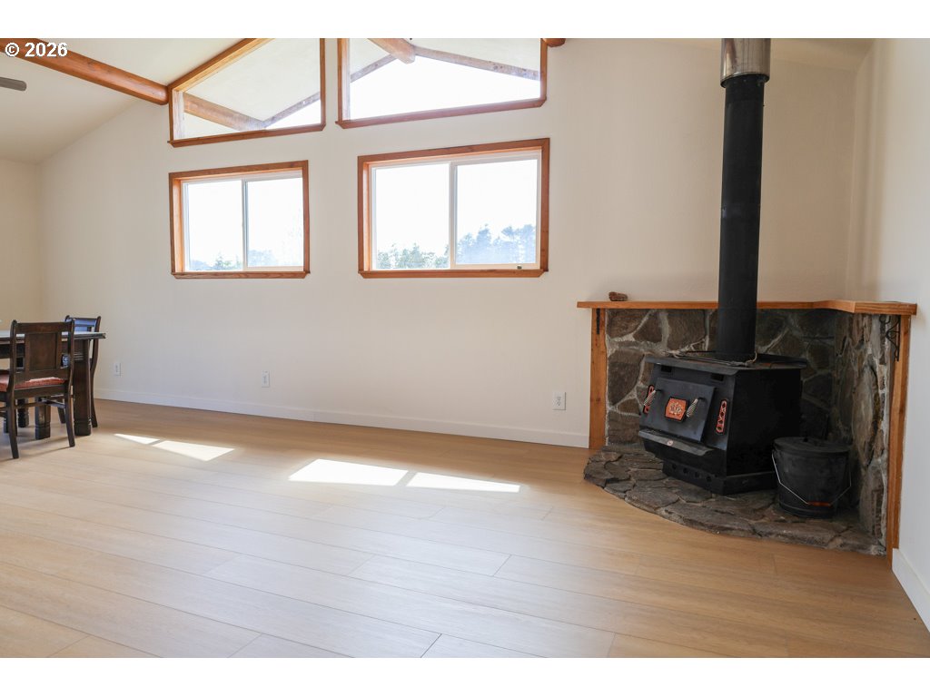 610 Tiara Street Lakeside, OR 97449 - Photo 7 of 28 a view of an empty room with wooden floor and a window