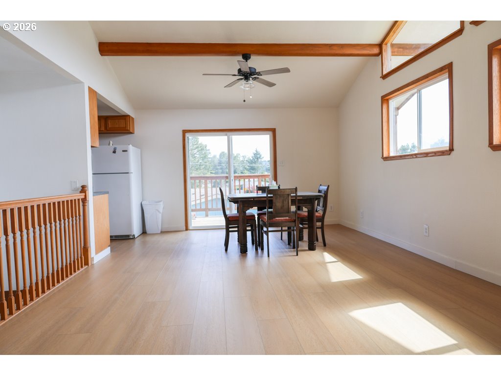610 Tiara Street Lakeside, OR 97449 - Photo 8 of 28 a dining room with furniture and chandelier