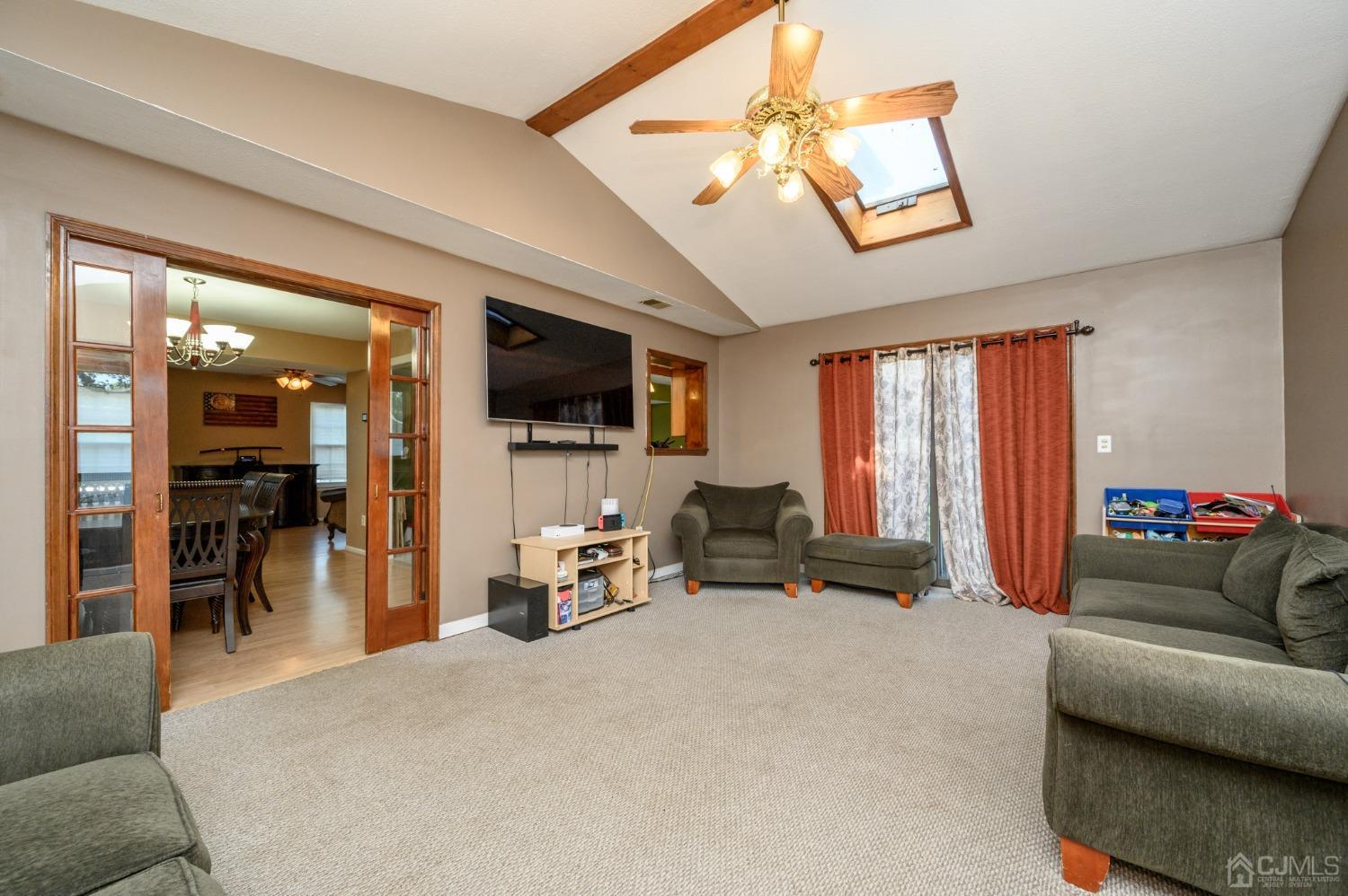 7 Blueberry Path Howell, NJ 07731 - Photo 11 of 39 a living room with furniture and a flat screen tv