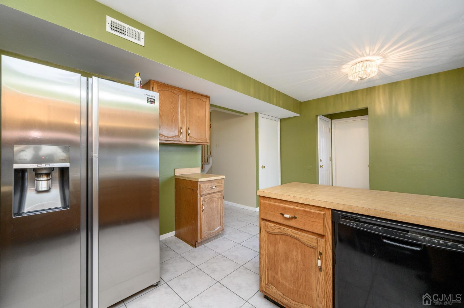 7 Blueberry Path Howell, NJ 07731 - Photo 17 of 39 a kitchen with a refrigerator and a sink