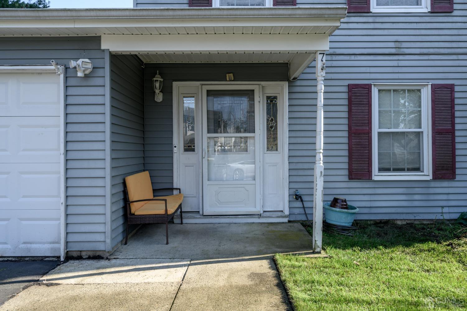 7 Blueberry Path Howell, NJ 07731 - Photo 2 of 39 a front view of a house with outdoor seating