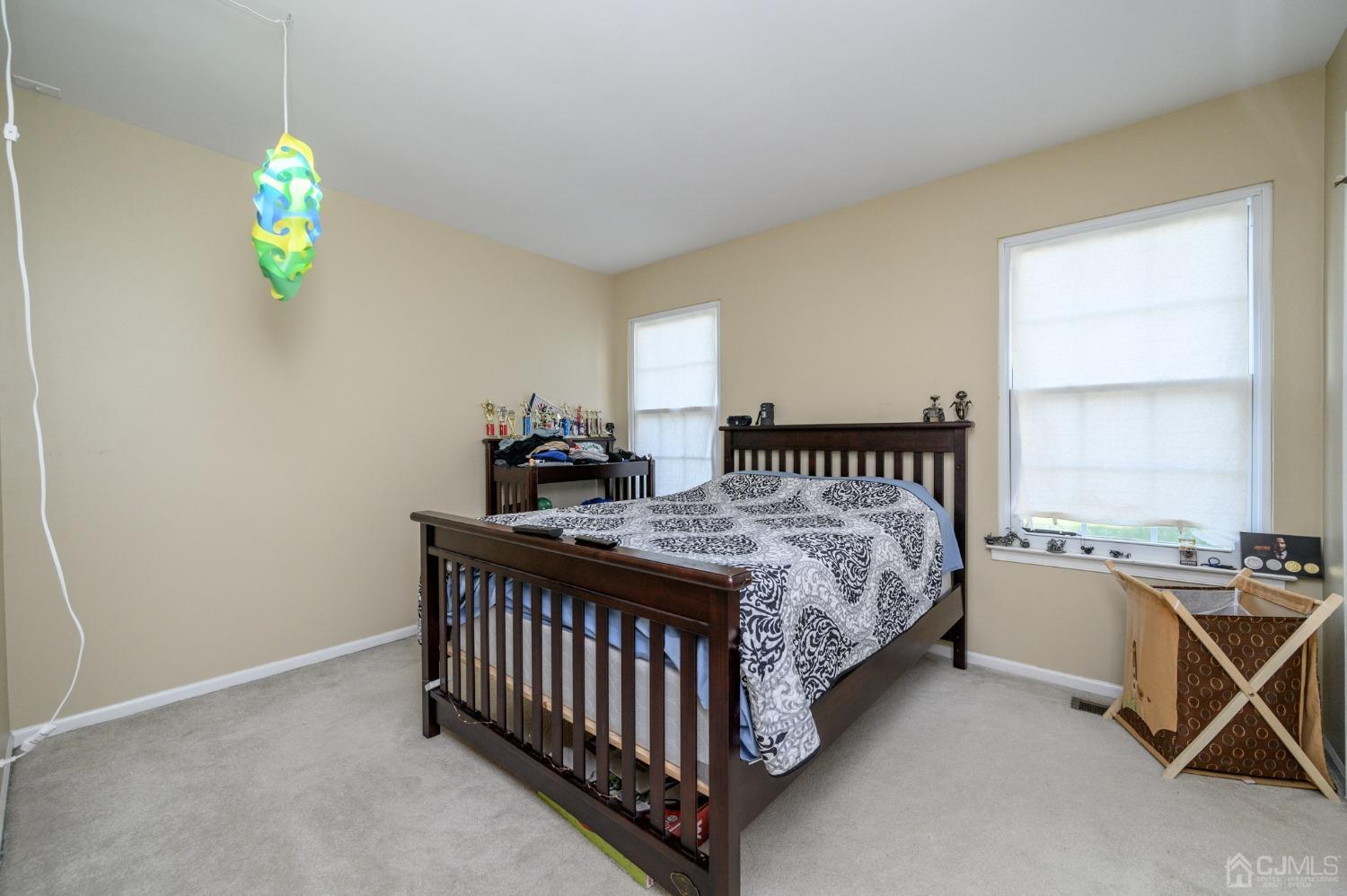 7 Blueberry Path Howell, NJ 07731 - Photo 24 of 39 a bed room with a bed and a table
