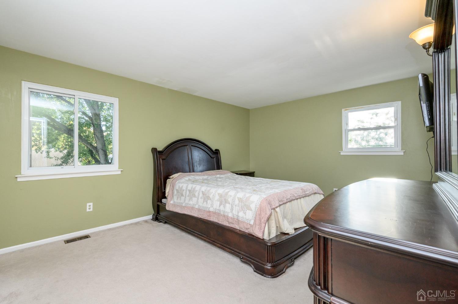 7 Blueberry Path Howell, NJ 07731 - Photo 30 of 39 a bedroom with a bed and windows