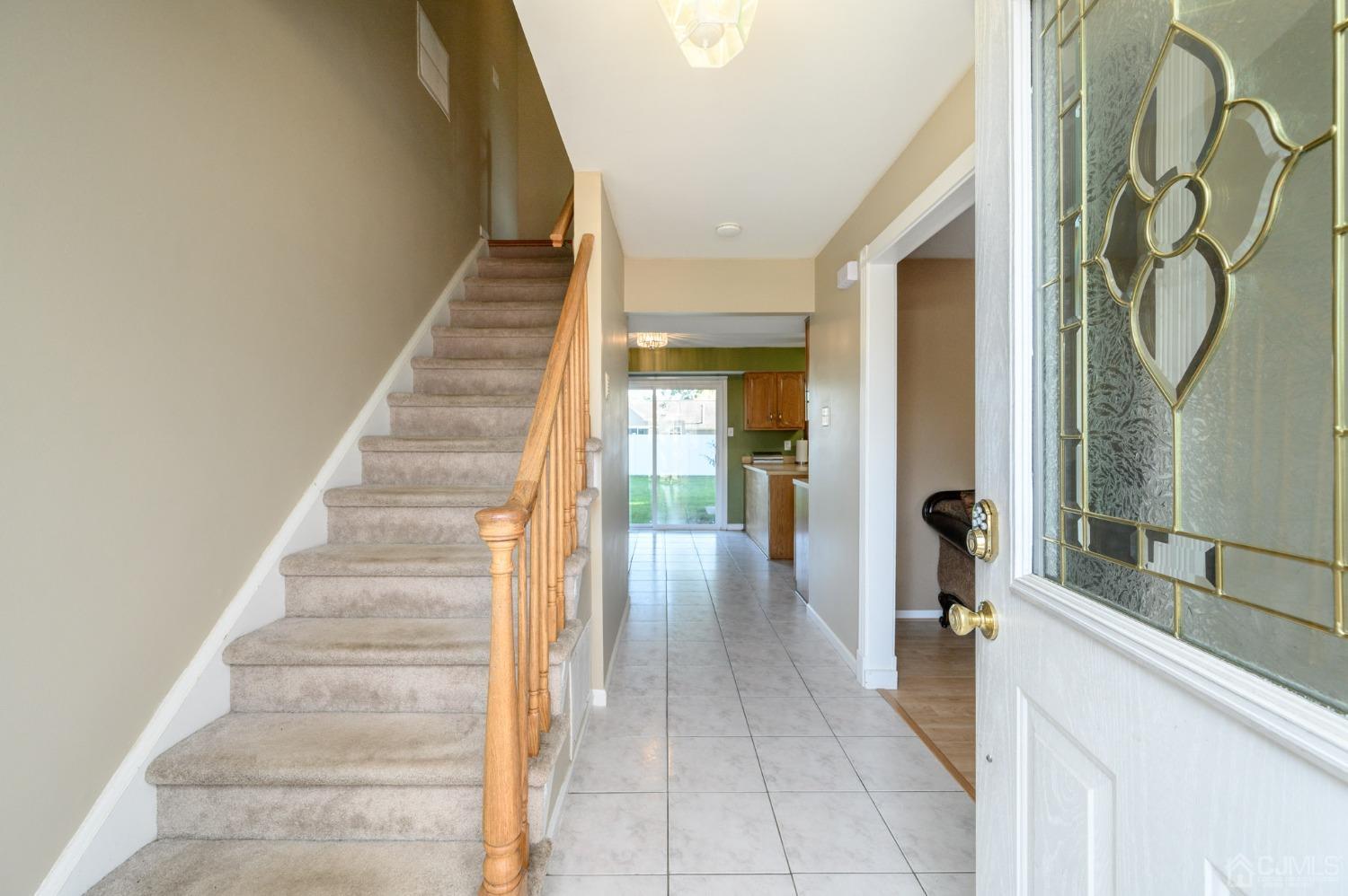 7 Blueberry Path Howell, NJ 07731 - Photo 3 of 39 a view of a hallway with wooden floor and entryway