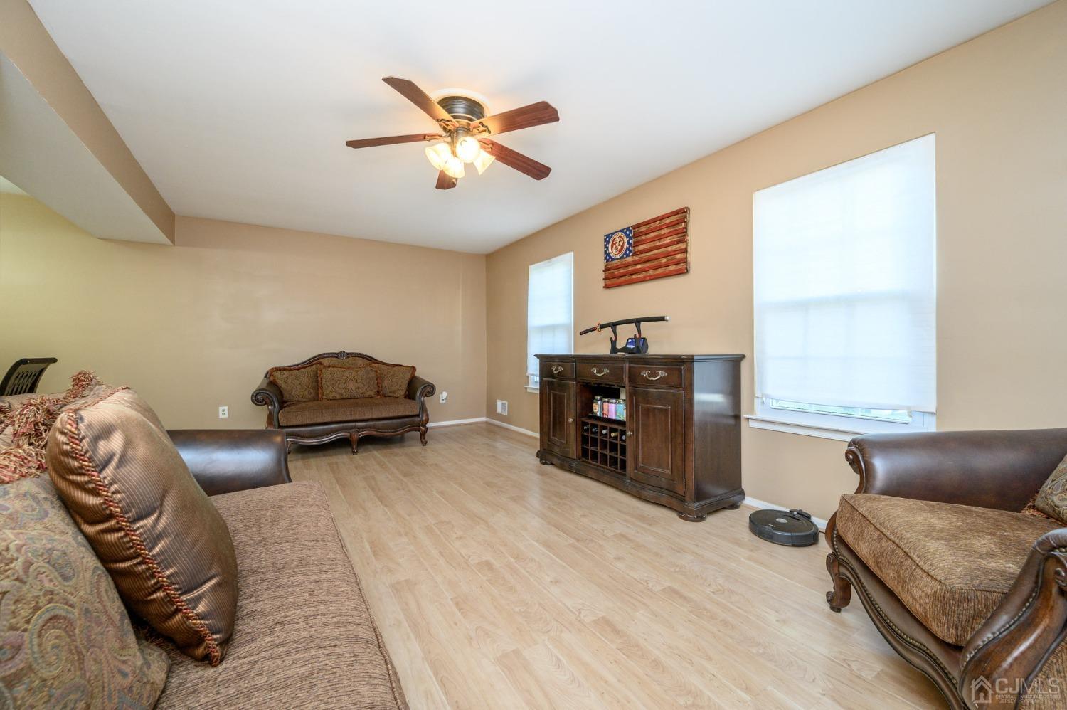 7 Blueberry Path Howell, NJ 07731 - Photo 4 of 39 a living room with furniture and a chandelier