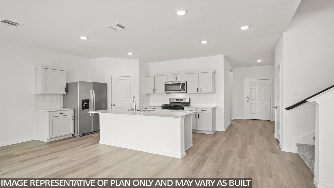 565 Wax Myrtle Way Hockley, TX 77447 - Photo 2 of 14 a kitchen with refrigerator and cabinets