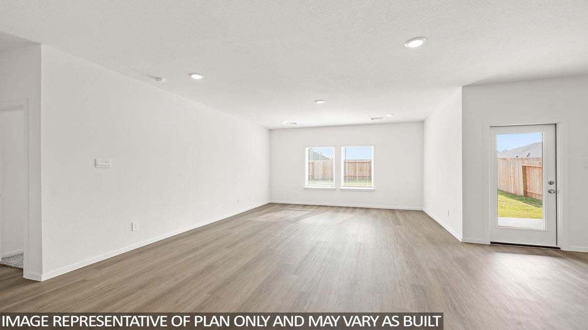 565 Wax Myrtle Way Hockley, TX 77447 - Photo 4 of 14 an empty room with wooden floor and windows