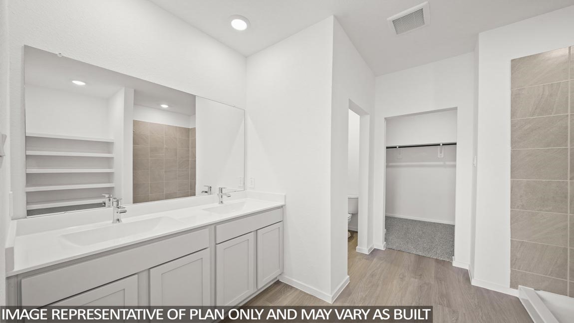 565 Wax Myrtle Way Hockley, TX 77447 - Photo 7 of 14 a bathroom with a sink and a mirror
