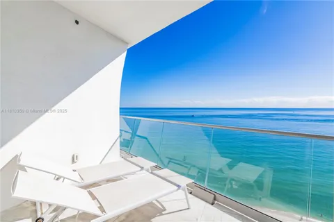 a view of a swimming pool and an outdoor space