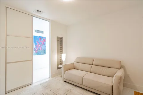 a living room with couch and a table