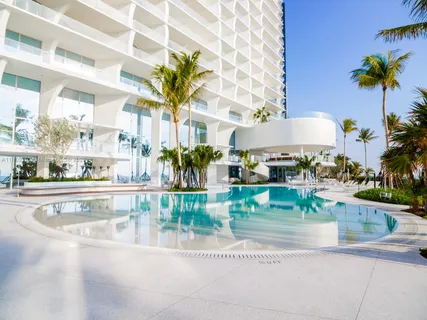 a view of a living room and a swimming pool