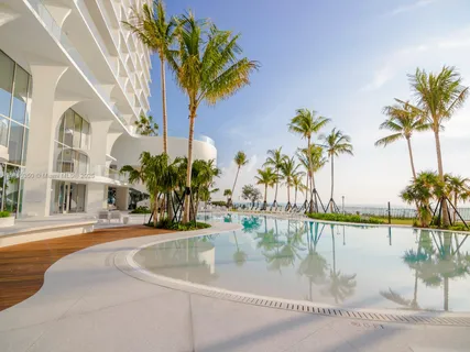 a view of a swimming pool with a table and chairs