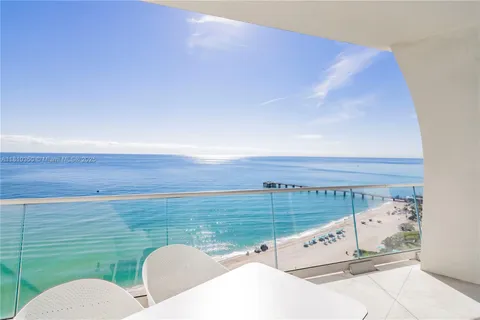 a view of a two chairs in the terrace